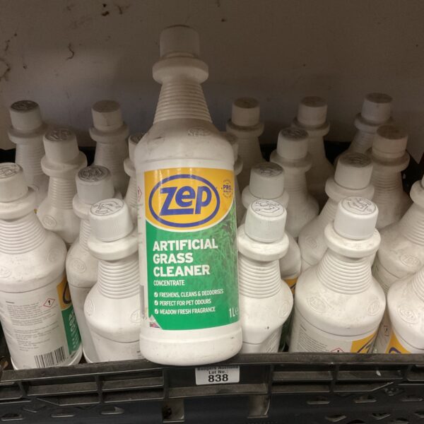 Multiple bottles of Zep artificial grass cleaner concentrate for outdoor use.
