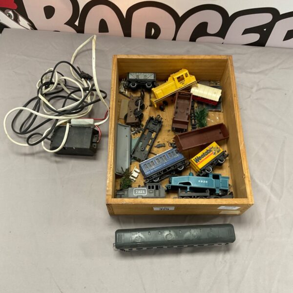 Vintage 00 scale train set with locomotives and track pieces.
