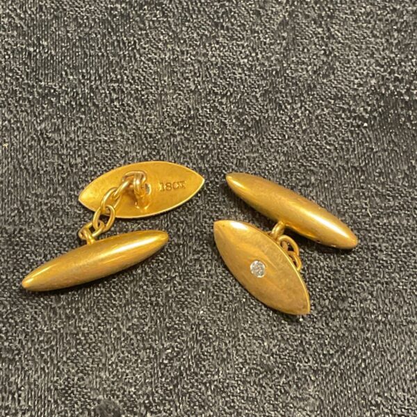 Elegant 18ct gold cufflinks with a single diamond detail.
