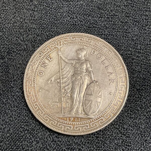 1911 British Trade Dollar silver coin featuring Britannia.