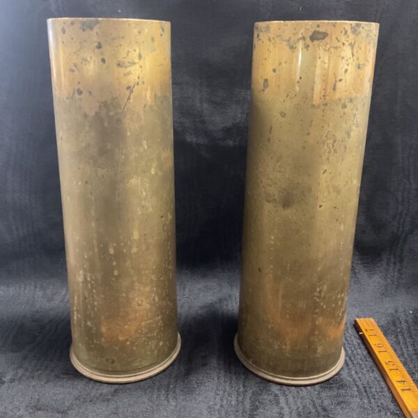 Pair of vintage 25 Pr cannon shell cases with brass finish.