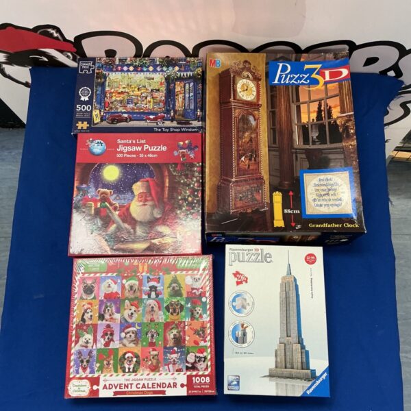 Collection of 3D puzzles including a Grandfather Clock and Empire State Building.