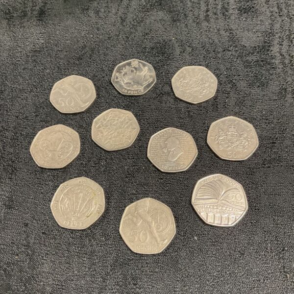 Collection of 50p coins including Sherlock Holmes commemorative edition.