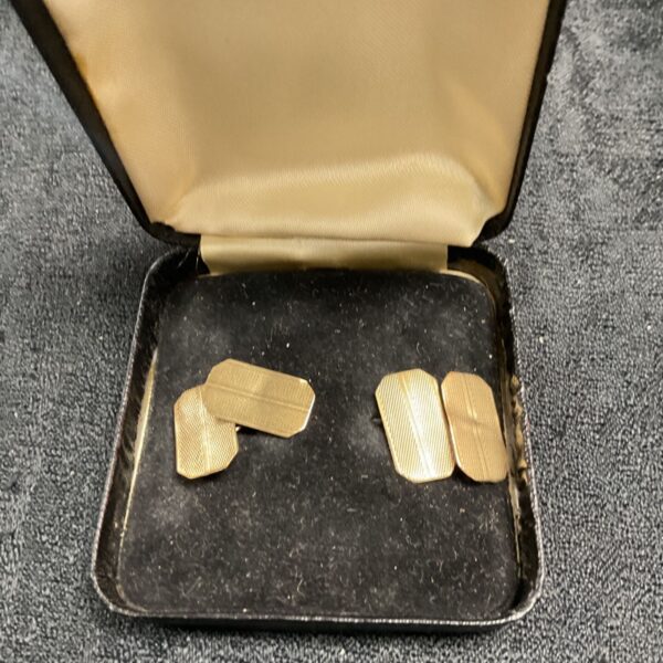Pair of vintage 9ct gold cufflinks on a display card.