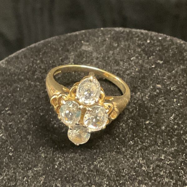Close-up of a 9ct gold ring with a white topaz cluster.