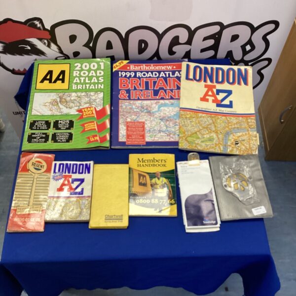 Collection of vintage AA road atlases and travel handbooks.