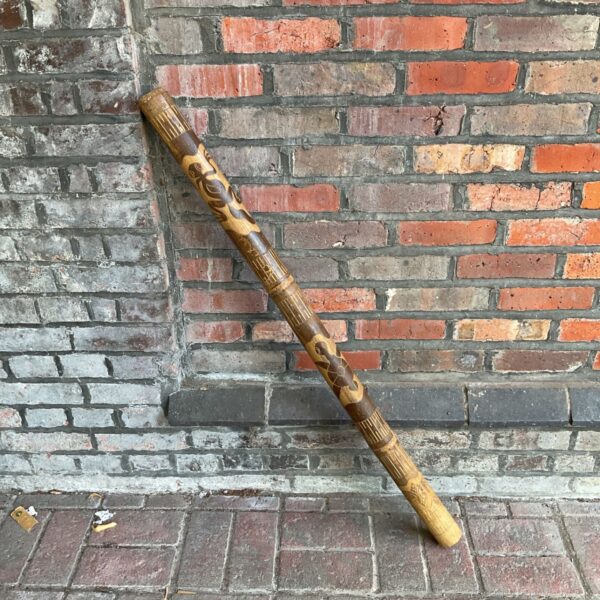 Painted Aboriginal didgeridoo, a traditional Australian musical instrument.