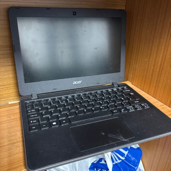 Used Acer laptop showing the screen and keyboard.