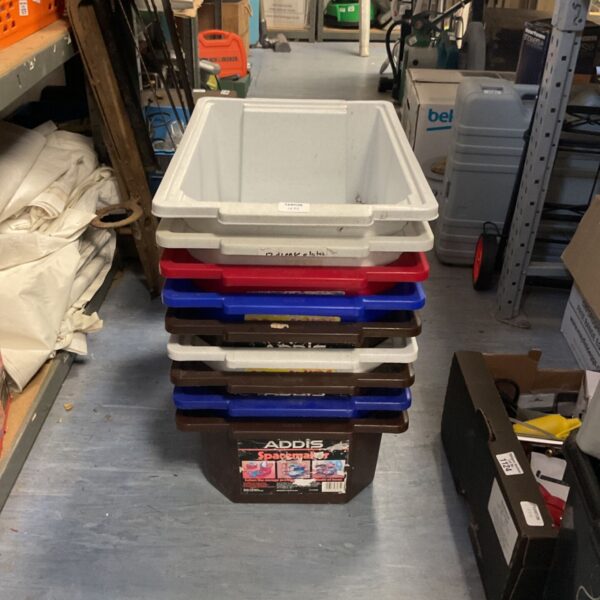 Lot of nine Addis Spacemaker plastic storage boxes for household storage.