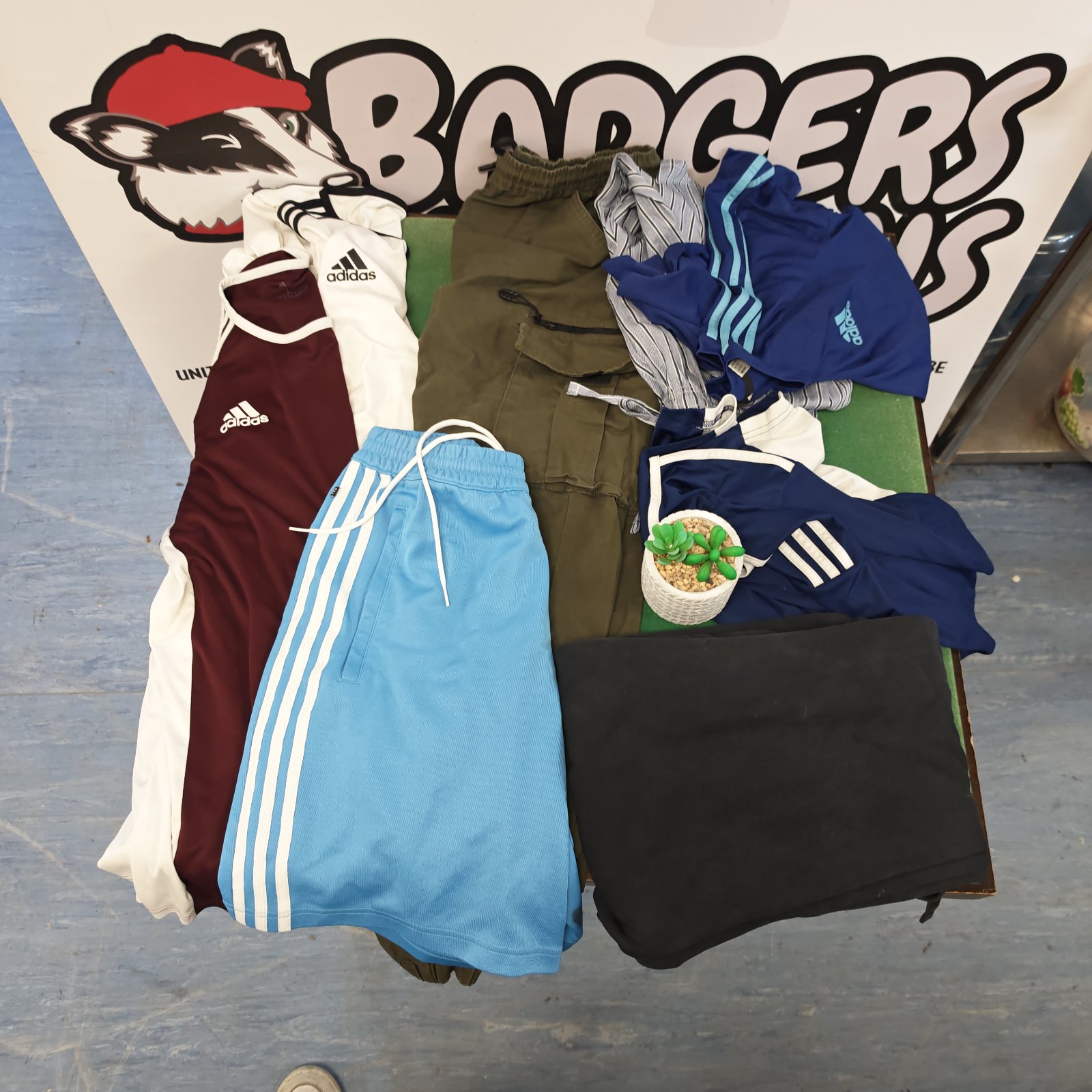 Used Adidas clothing lot featuring colourful athletic shorts.