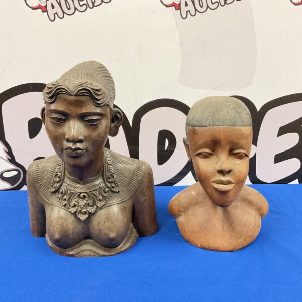 Two antique African tribal busts carved from dark hardwood.