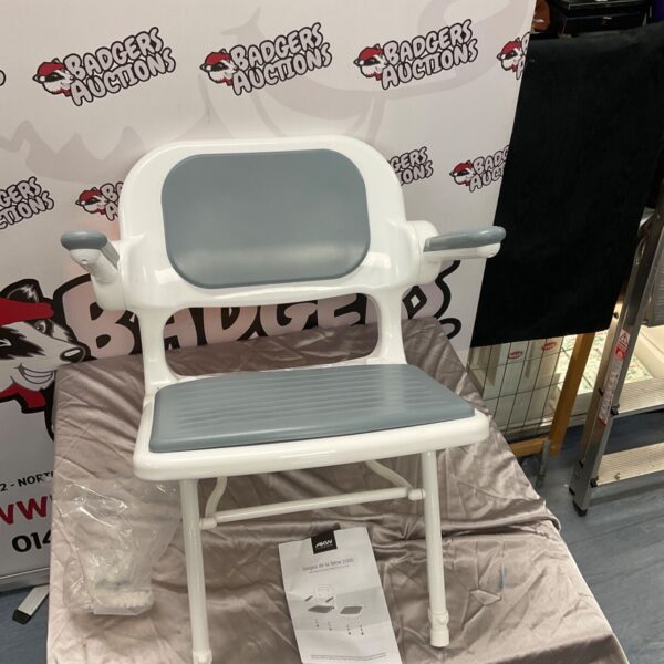White AKW shower seat with chrome frame, ideal for bathroom accessibility.