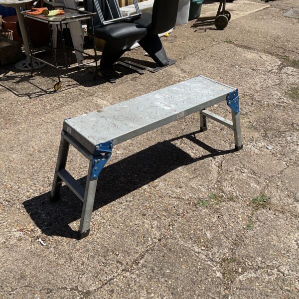 Aluminium platform step for decorators, showing signs of wear.