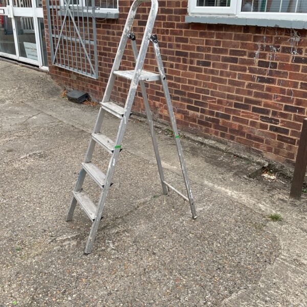 Aluminium step ladder with three steps, showing signs of wear.