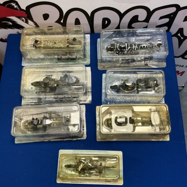 Lot of seven AmerCom scale model military helicopters in packaging.