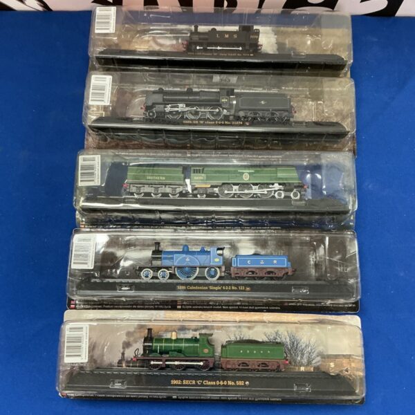 AmerCom scale model railway trains set in original packaging.