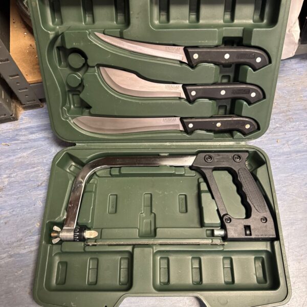 American Outdoor Life survival set with knife and saw in green case.