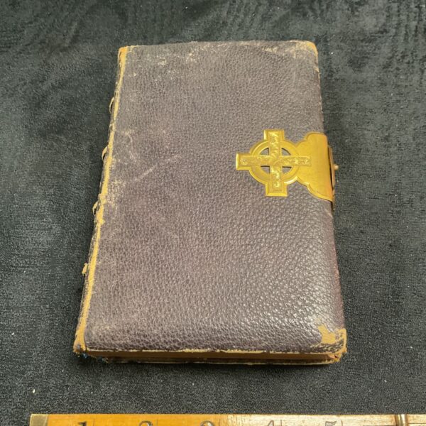 Antique 1880 Holy Bible with ornate gilt cross clasp.