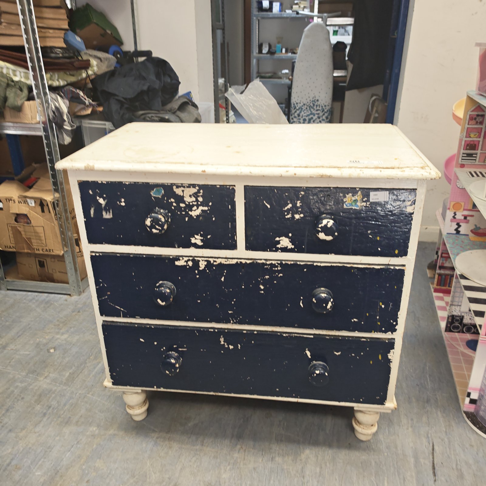 Antique blue chest of drawers with distressed paint.