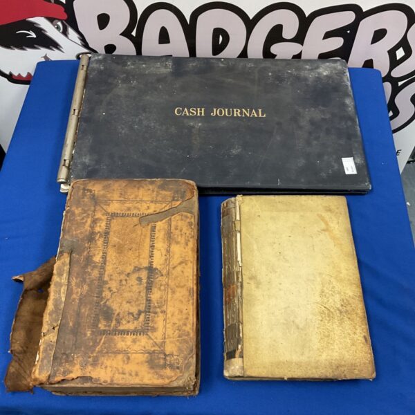 Antique books and ledgers including a 1733 Flavius Josephus edition.
