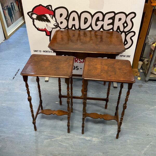 Antique burr walnut nest of tables with turned legs.