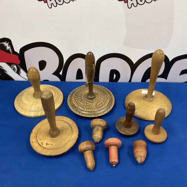 Antique wooden butter workers and darning mushrooms for textile repair.