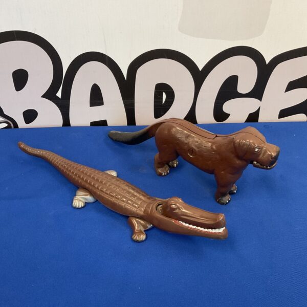 Antique cast iron crocodile and dog nutcrackers, vintage kitchen collectibles.