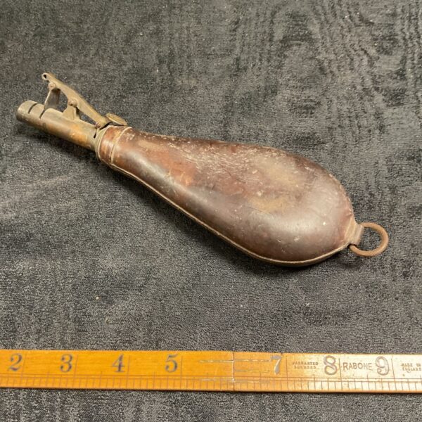 Antique leather shot flask with remaining shot, Victorian hunting accessory.