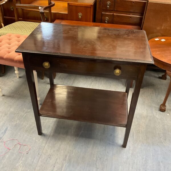 Antique mahogany side table with two tiers and a single drawer.