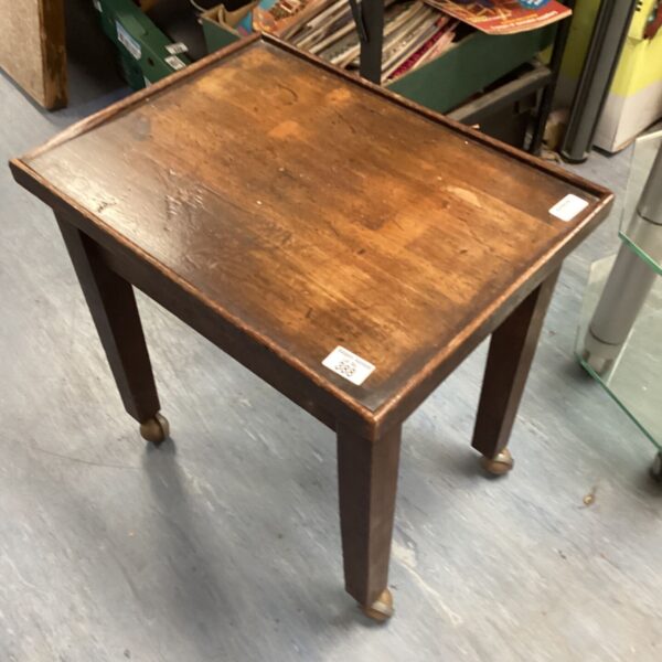 Antique mahogany wine table with casters, Victorian style.