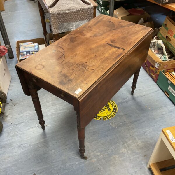 Antique Pembrooke table with a single drawer and tapered legs.