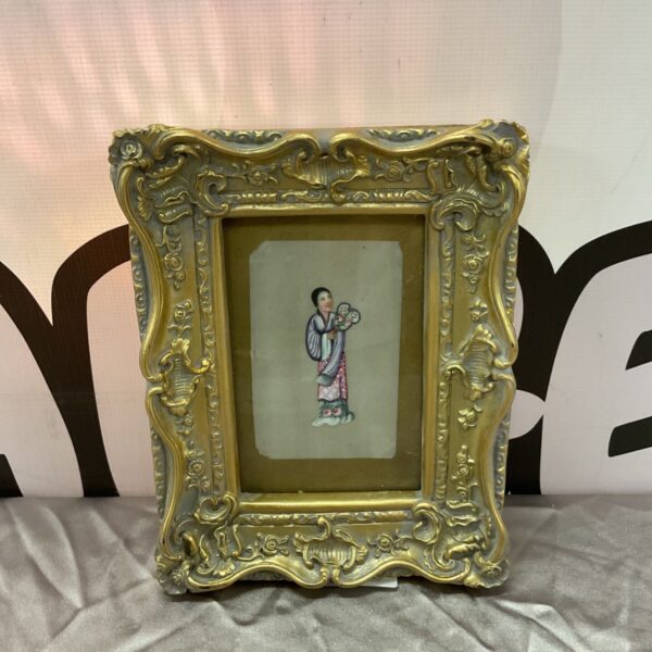 Antique pith portrait of a lady in a gilt frame.