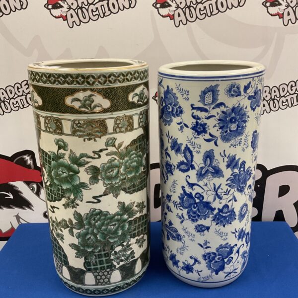 Antique porcelain umbrella stand with floral design, vintage hallway decor.
