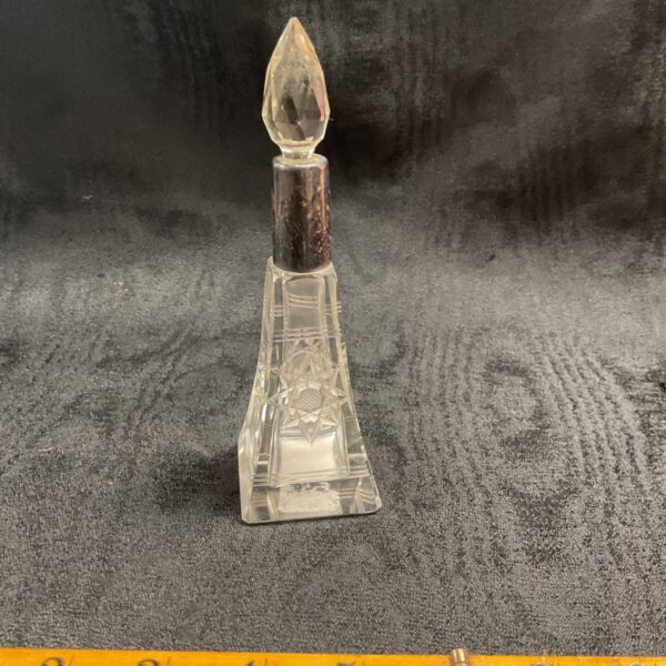 Antique silver mounted perfume bottle with ruler for scale.