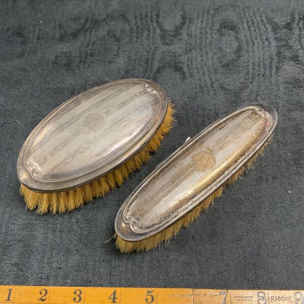 Antique sterling silver backed brushes, a vintage pair.