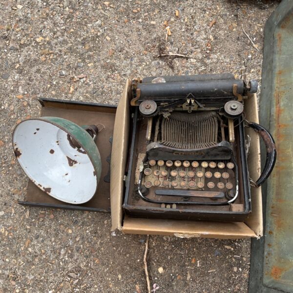 Antique typewriter awaiting restoration, vintage office machine.