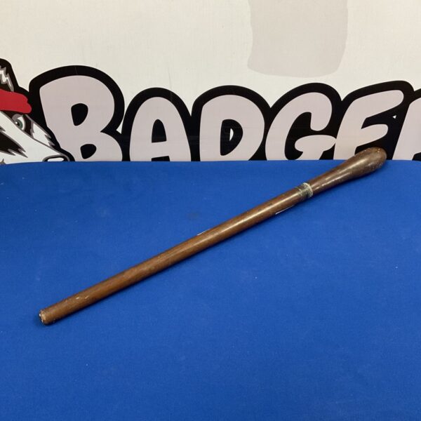 Antique wooden truncheon, a vintage police baton for collectors.