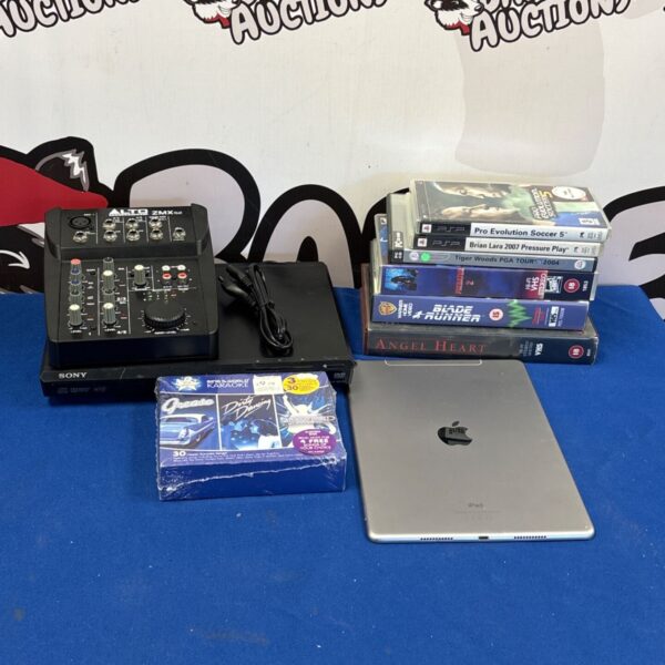 Apple iPad with Sony DVD player and video games in a mixed lot.