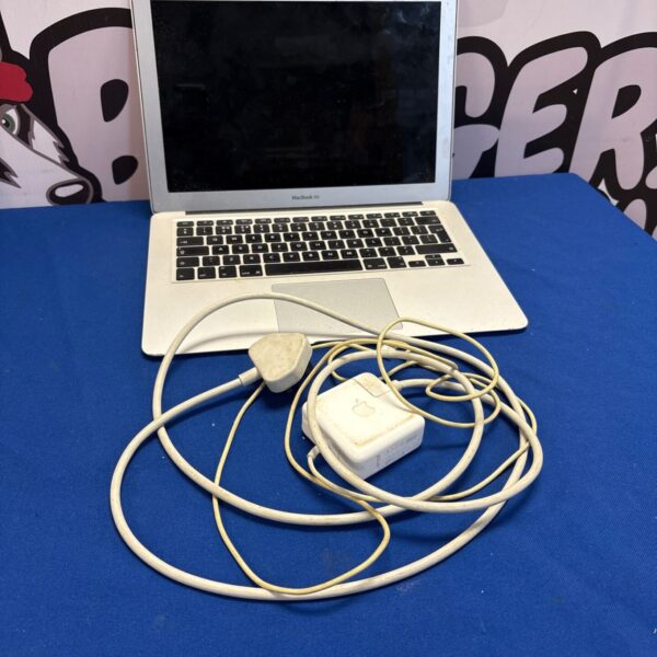 Silver Apple Macbook Air A1466 laptop with charger included.