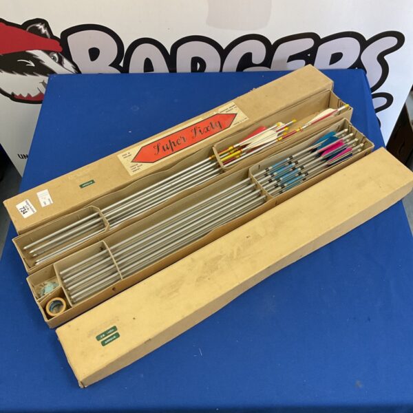 Vintage archery arrows including a Super Sixty set in original packaging.