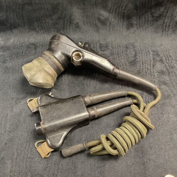Vintage armoured vehicle intercom mouthpiece with coiled cable.
