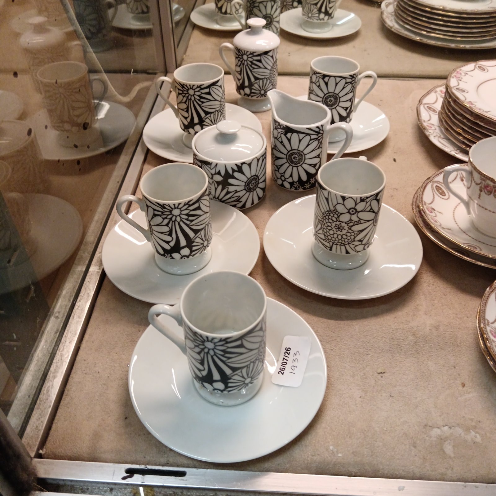 Vintage Art Deco Japanese coffee cup and saucer set with geometric pattern.