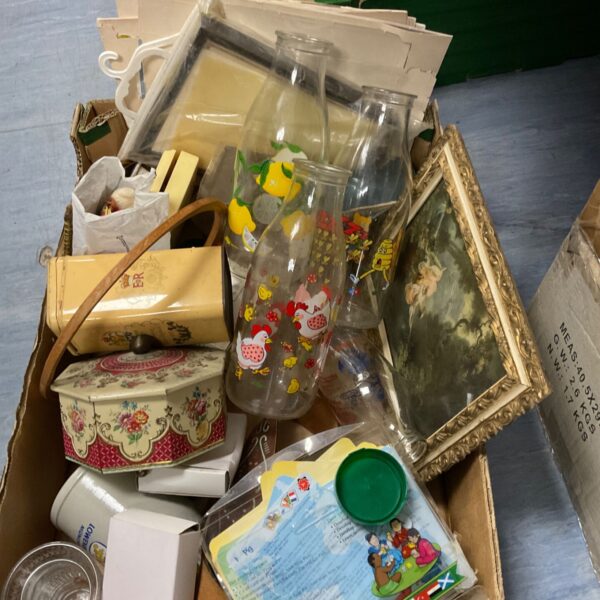 Assorted collectibles tray with vintage bottles and ephemera.