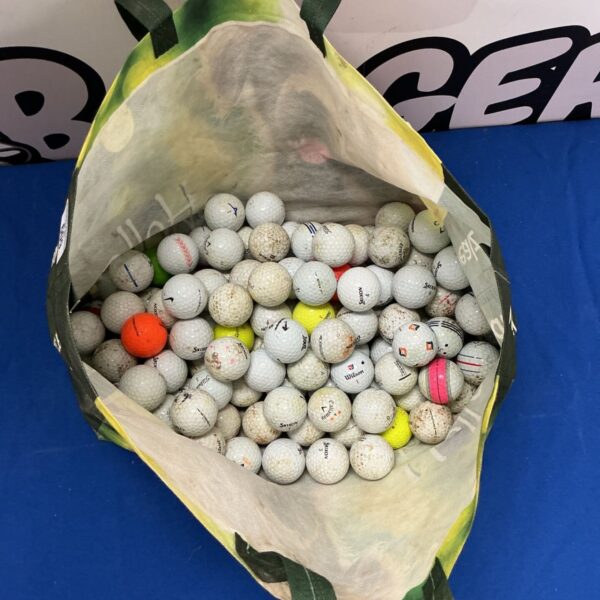 Assorted golf balls in a bag, including Nike, Titleist, and Callaway brands.