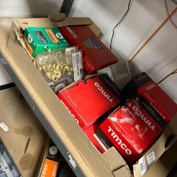 Box of assorted screws and fittings for DIY projects.
