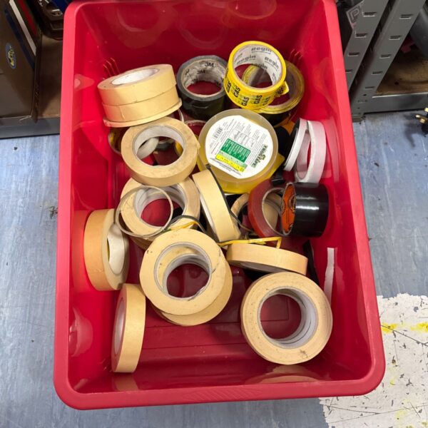 Tray of assorted tape rolls for packing and DIY projects.