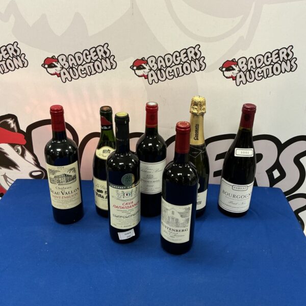 Assorted wine bottles including Rustenberg, Cava, and Chateau du Beau Vallon.
