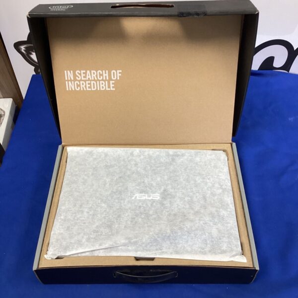 Asus laptop exterior view, showing wear and tear.