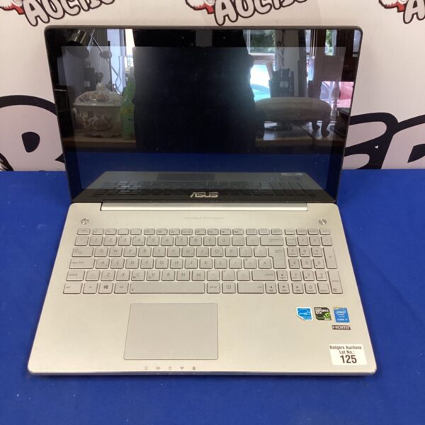 Silver Asus laptop with keyboard visible, offered for parts.