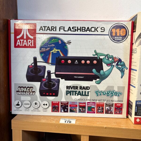 Boxed Atari Flashback 9 console with classic Atari games listed.